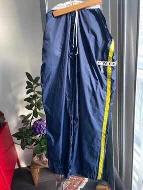 Nike Navy Track Pants with Yellow Stripe